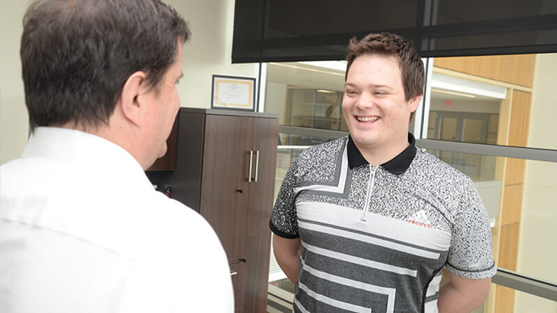 Student talking to employer