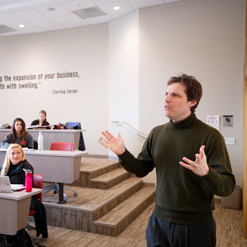 Faculty member talking to classroom
