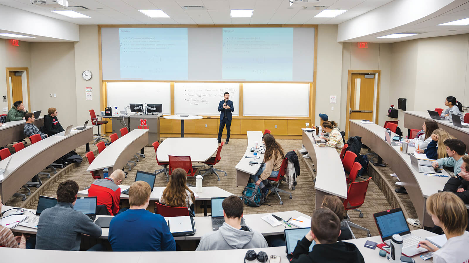 Students listen to teacher in classroom