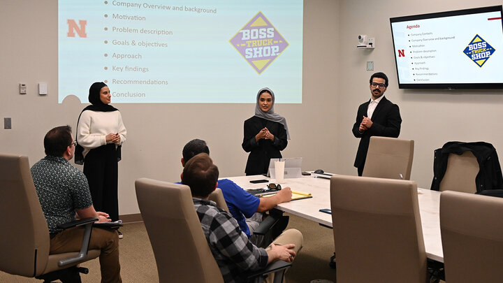 Students presenting in their scm course
