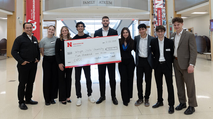 Managing directors of the Husker Venture Fund (left) award Wayne State University in Michigan students first place in the inaugural Cornhusker Venture Capital Competition.