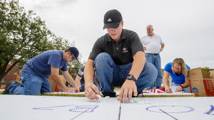 John Lang captures the imagination of the Husker community by setting a Guinness World Record for largest logo made with interlocking plastic bricks.