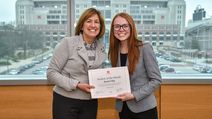 Dean Kathy Farrell presents Rachel Olig with the Student of the Month certificate.