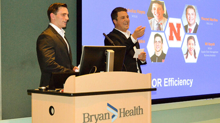 Dominik Redden and Vincent Martino present their team’s plan on Operating Room Efficiency and ways to cut cost in the OR.
