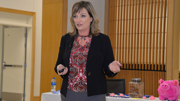 Dr. Melissa Griswold sees her book on financial literacy as a service project and a way to give back to young people.