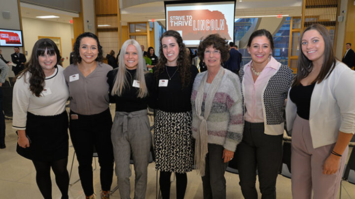 Rhonda Seacrest, Strive to Thrive Lincoln supporter, poses with students at the awarding ceremony.