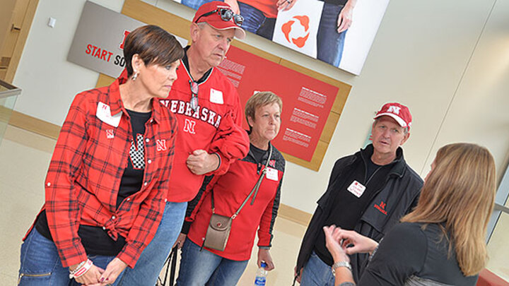 Alums toured Howard L. Hawks Hall including Connie (far left) and Wendell (second from right) Peters, who came from Phoenix to attend the tailgate. Also pictured are Rod and Rhonda Peters.