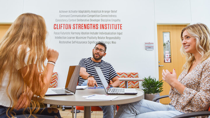 Student strengths coaches meet in the Clifton Strengths Institute in Hawks Hall.
