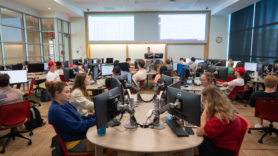student leading a supply chain course