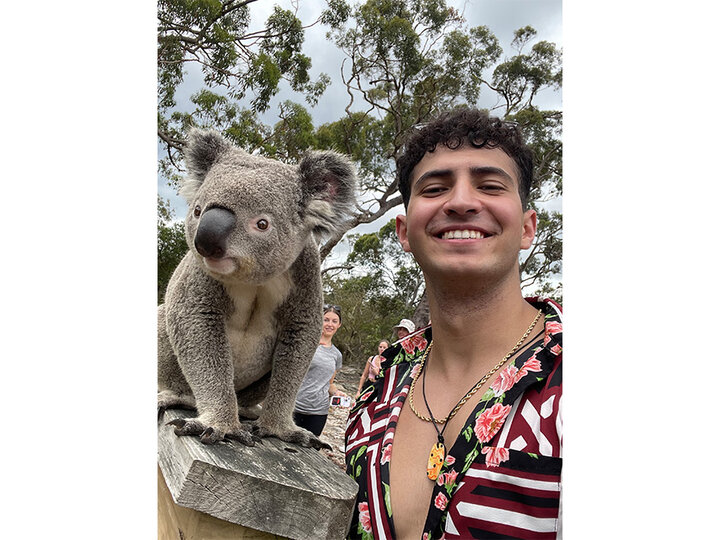 student with a koala