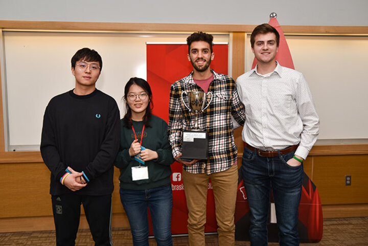 Favazza and his team proudly hold the trophy for first place for the 48-Hour Challenge, which will have their team name engraved on it.