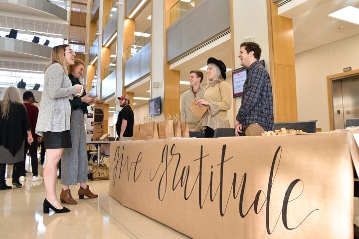 Paxton Brittingham, at center right, participated in the Builders Marketplace in Hawks Hall in 2019. For the one-day event, the Clifton Builders cohort divided into teams to sell products or services, where they gained experience launching a business.