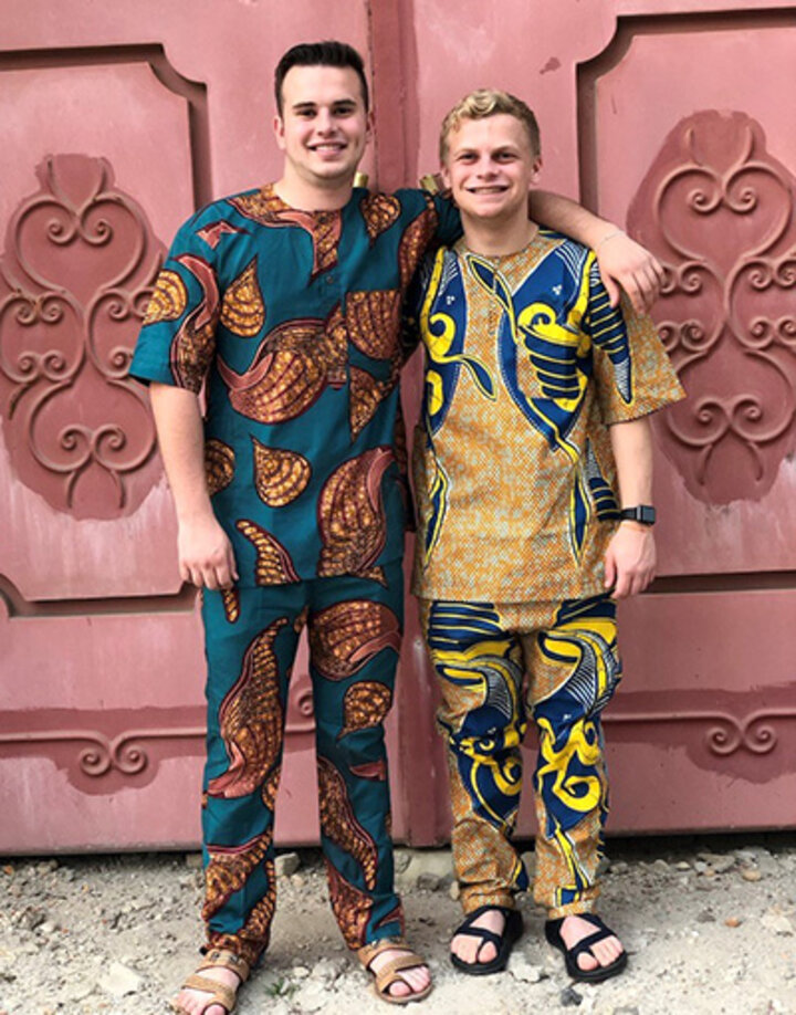 Tyler Jacobson and Chase Caverzagie wear the new outfits they successfully negotiated for at a market.