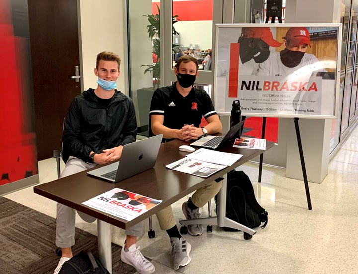Bowman and Braly Keller, ’21, set up NIL Advisor office hours in Memorial Stadium to connect with Husker athletes.
