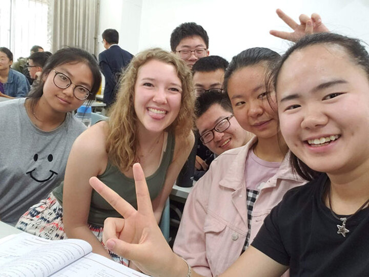 Christy Cooper makes new friends in English class at Northwest Agriculture & Forestry University.