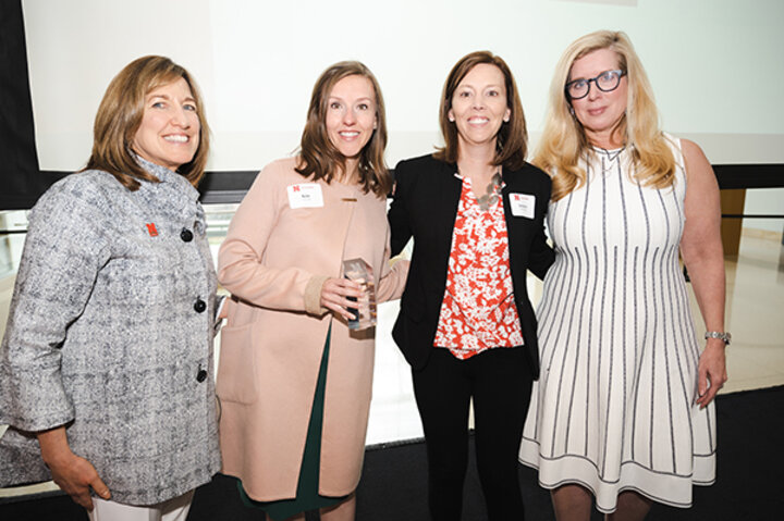 Jennifer Bartholomew, '03 & '07, and Kim Neuwirth, '05, accepted the Lifetime Achievement Award on behalf of their mother JoAnn Martin.