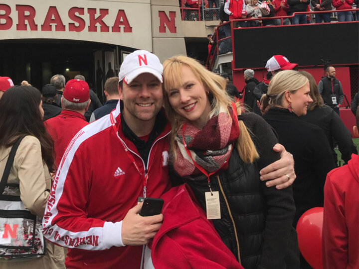 Chad Mariska and his wife, Amy, take in the sights and sounds of a Husker home football game.