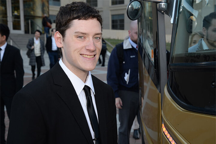 Hutchinson boards the bus with classmates headed for their final presentations in Omaha at Lincoln Financial Group.