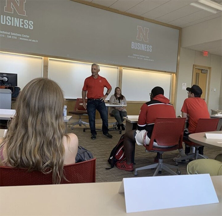 Jim Blue and Christina Lloyd speaking with the class about their organization