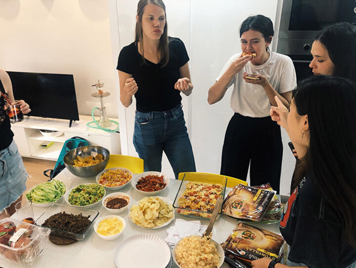 Nebraska students enjoy homemade nachos at their group dinner.