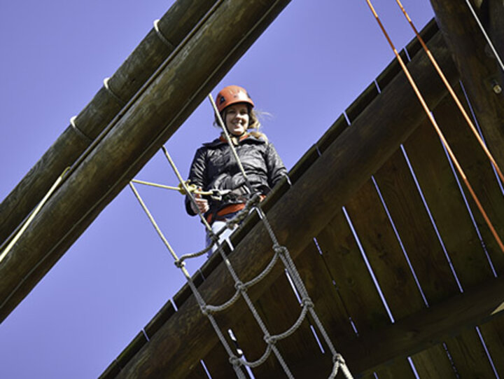 Dr. Tawnya Means climbed to the top of the high ropes obstacle course.